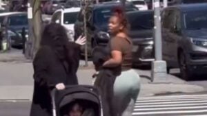 Woman spitting on another woman in NY